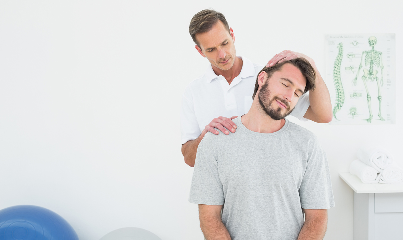 Chiropractor in Santa Barbara adjusting patient neck